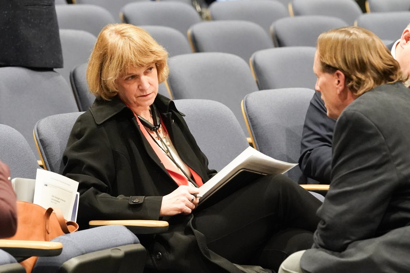 Human Services Commissioner Jodi Harpstead talked with Sen. Jim Abeler, R-Anoka, chairman of the Human Services Reform Finance and Policy Committee before the hearing started. The Legislative Auditor's office delivered a report on DHS oversight of personal care assistance.