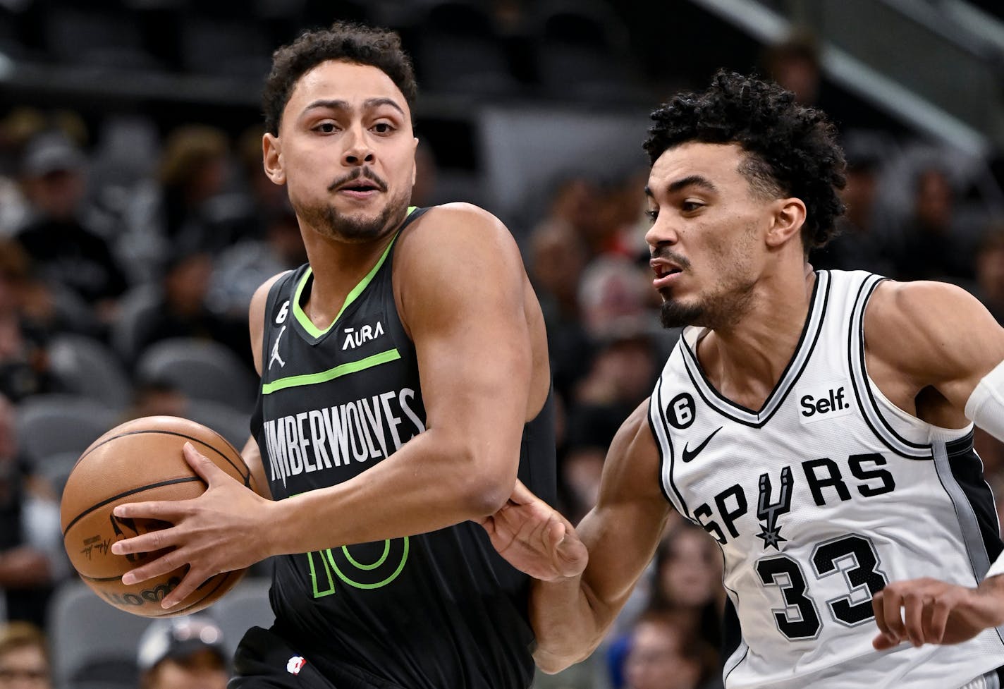 Bryn Forbes drives to the basket against San Antonio's Tre Jones during the first half on Oct. 30