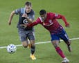 Minnesota United's Robin Lod, left, and FC Dallas' Andrés Ricaurte (11) vie for the ball during the second half of an MLS soccer match Wednesday, Sep