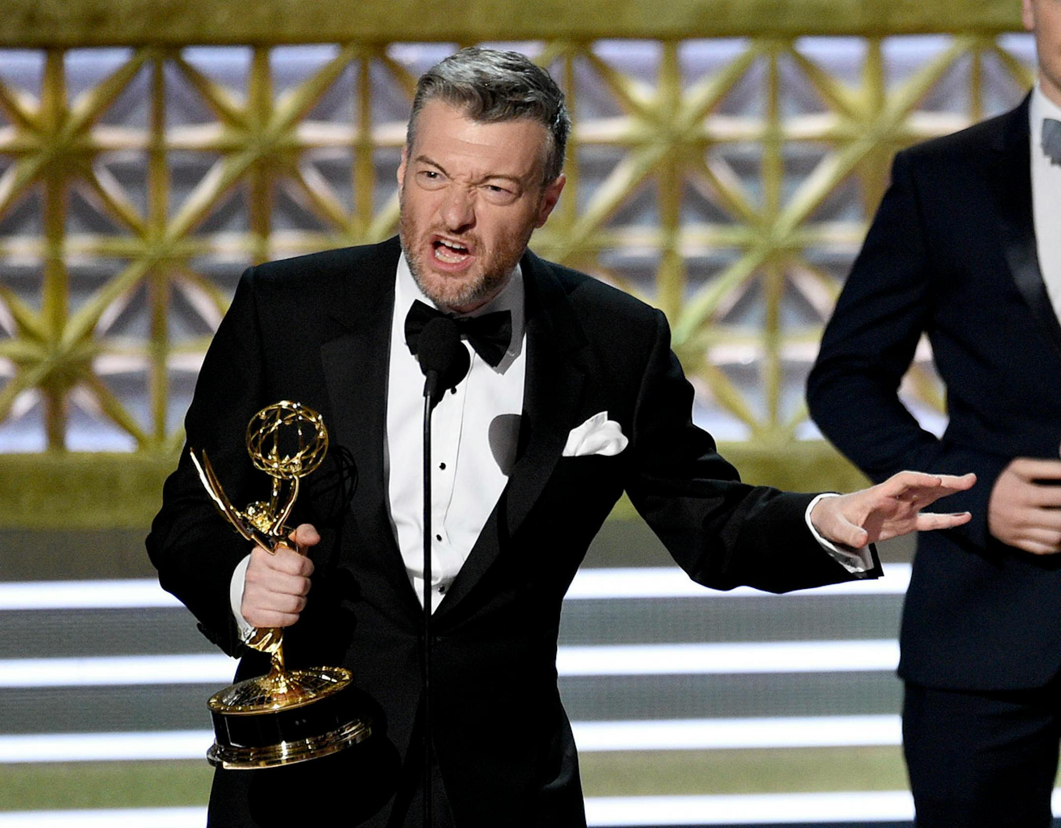 Charlie Brooker accepts the award for outstanding television movie for "Black Mirror: San Junipero" at the 69th Primetime Emmy Awards on Sunday, Sept. 17, 2017, at the Microsoft Theater in Los Angeles.