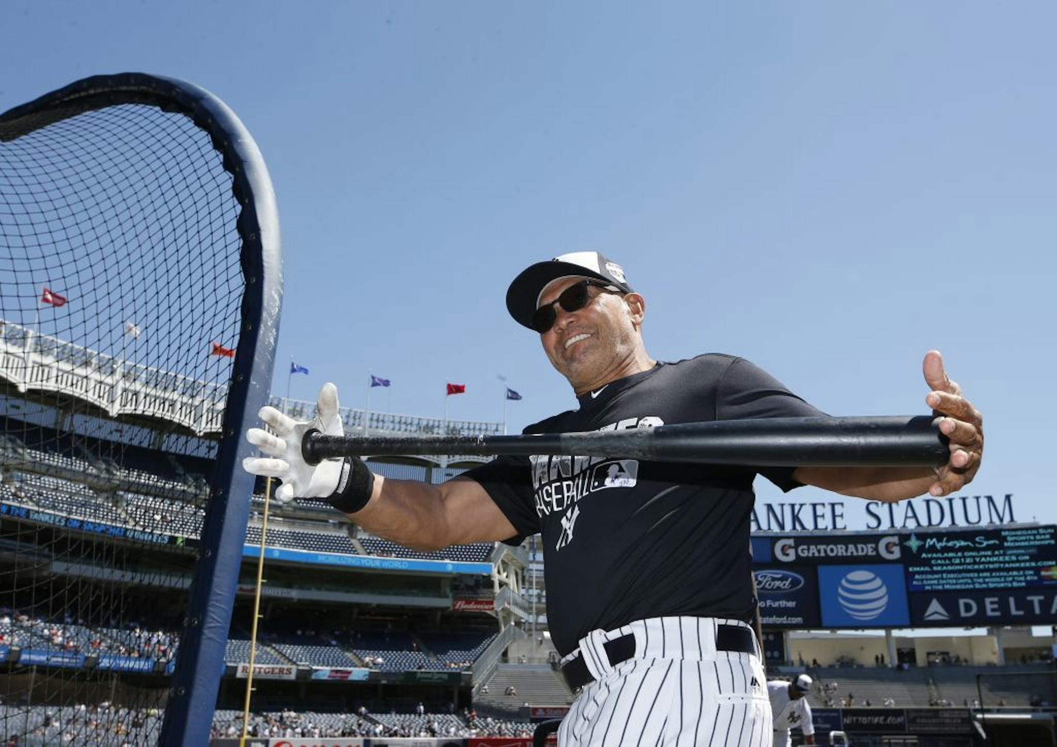 New York Yankees Hall of Famer Reggie Jackson stretches before the Yankees annual Old Timers Day baseball game, Sunday, June 12, 2016, in New York.