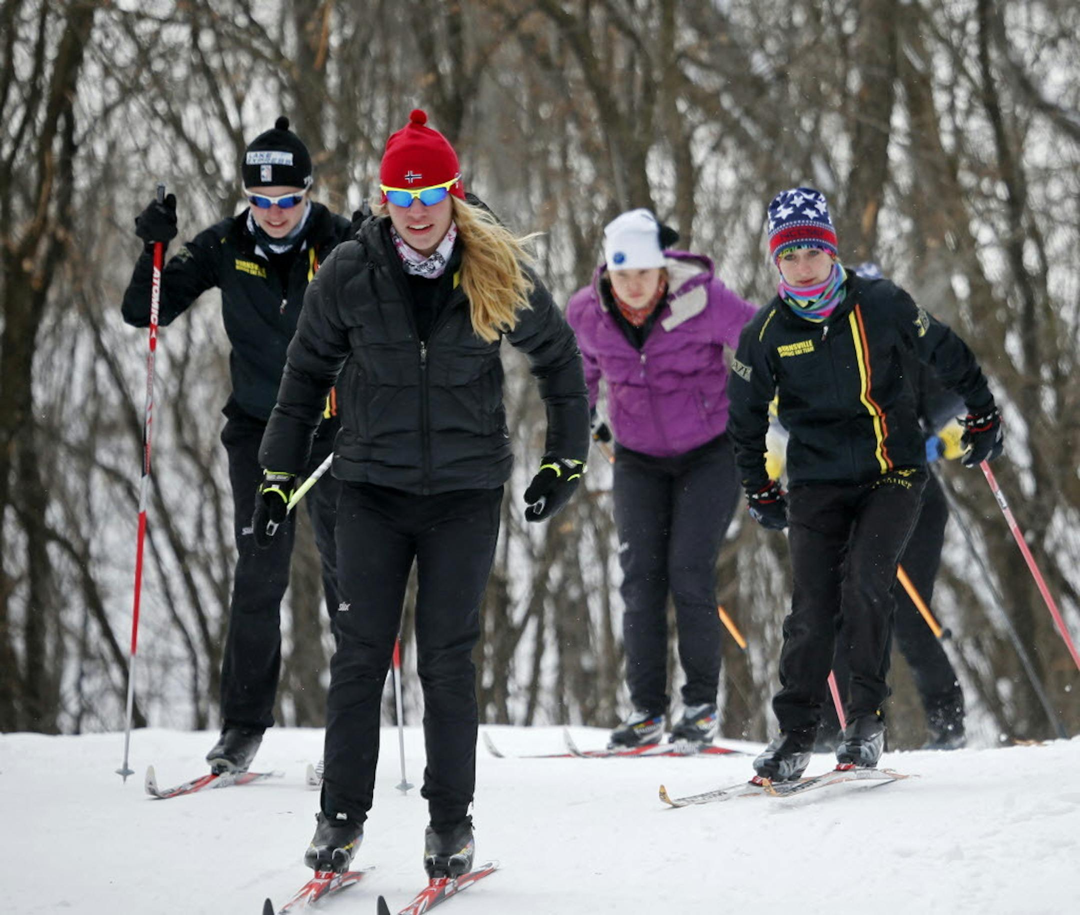 From left, Burnsville's Nordic ski team members Vivian Hett, Jane Koch, Krista Bain and Jordan Horner practiced at Terrace Oaks Park in Burnsville. This season, coach Chris Harvey added weightlifting to the veteran group's training, and that's helped put the team in a position to close in on a "championship season," he said. Photo by BRIAN PETERSON • brianp@startribune.com