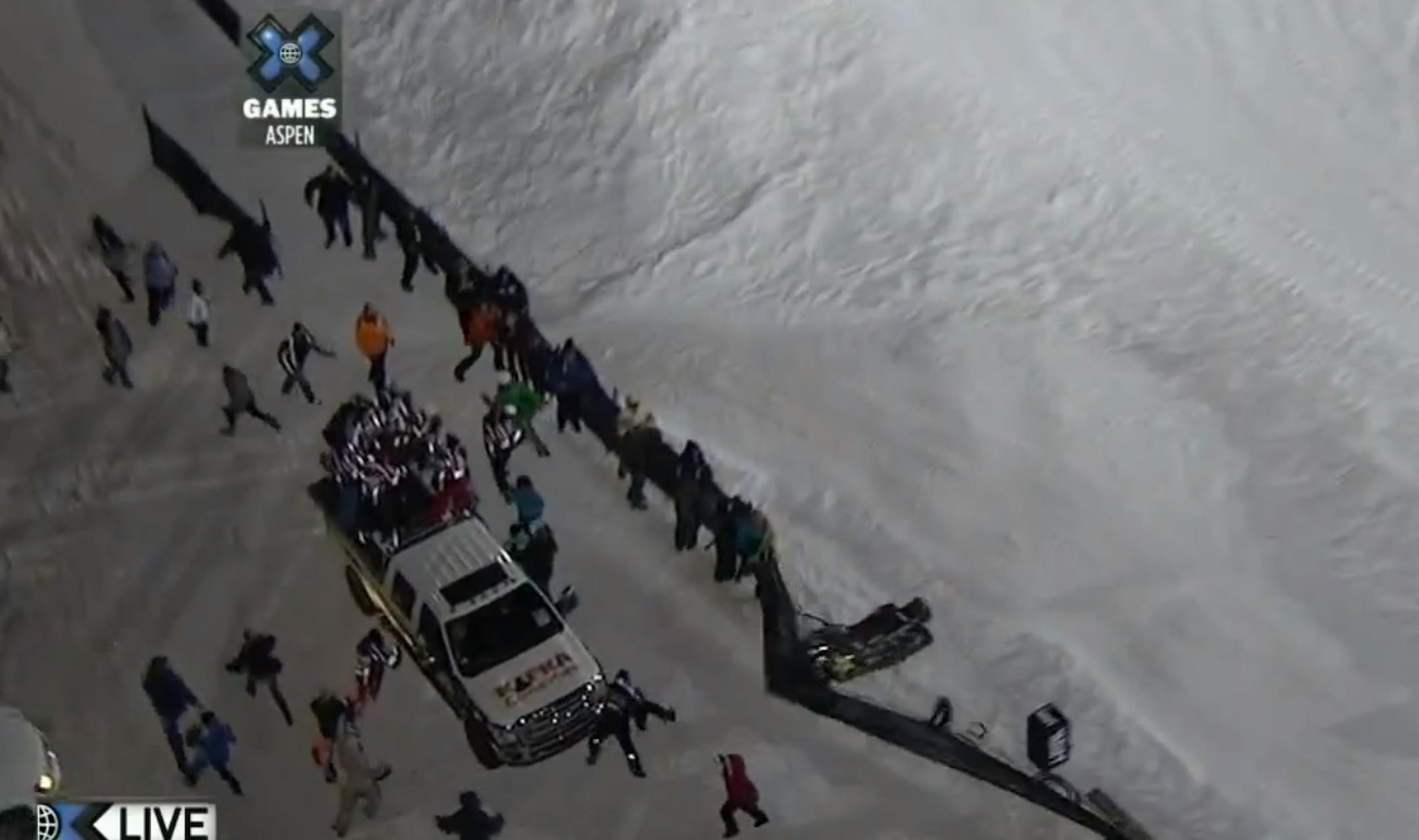 Near the left wheel of the pickup truck were Jeff Wittwer, of Bemidji, and his injured 13-year-old son, Trent. Both were hit by a wayward snowmobile at the Winter X Games in Aspen, Colo.