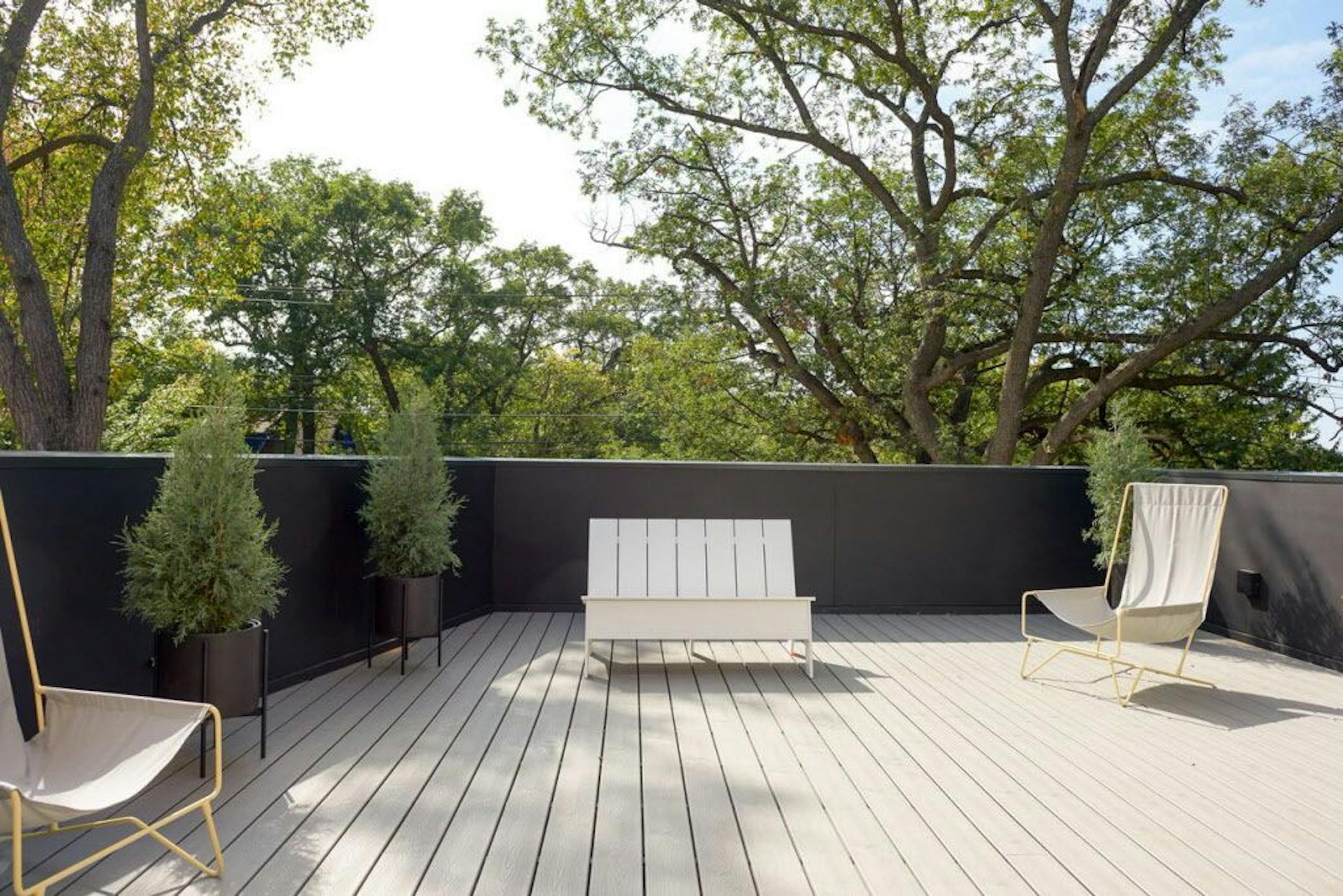 A rooftop deck above the garage offers views of the downtown Minneapolis skyline.