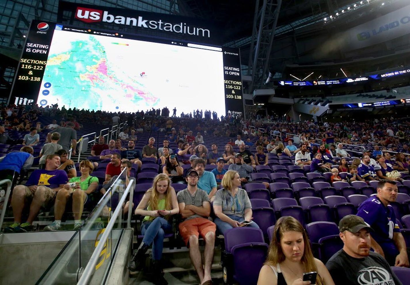 The radar of a passing storm plays on the giant video screen during the public opening at the U.S. Bank Stadium Saturday, July 23, 2016, in Minneapolis, MN.