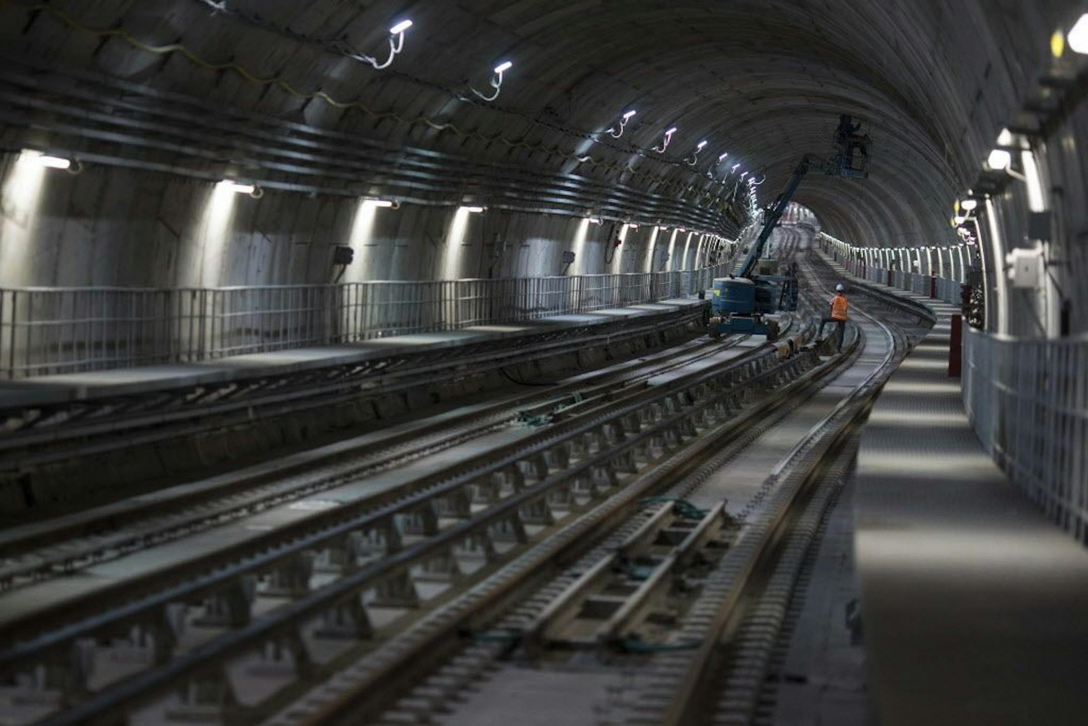 In this June 8, 2016 photo, men work in the new underground subway tunnel below Ipanema neighborhood in Rio de Janeiro, Brazil. Last-minute construction on the line has created fears after an April bike lane collapse that plunged two joggers to their deaths. An ocean-front section of the lane, an Olympic beautification project inaugurated in January, collapsed into a heap of broken cement when struck by a large wave.