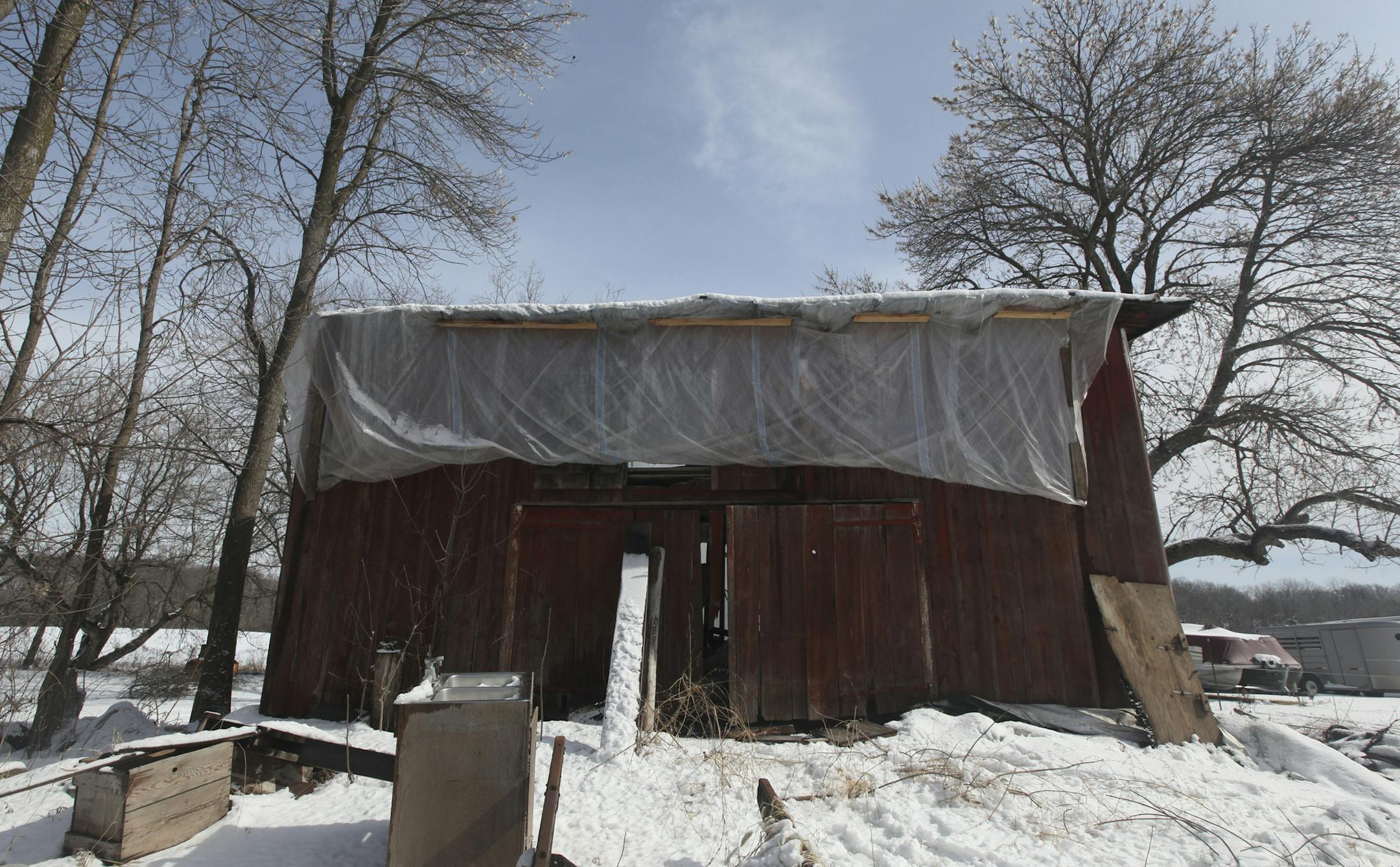 Tarps covered up parts of the north barn built 150 years ago by Swedish immigrant Andrew Peterson in Waconia Min., Friday, March 2, 2012. ] (KYNDELL HARKNESS/STAR TRIBUNE) kyndell.harkness@startribune.com