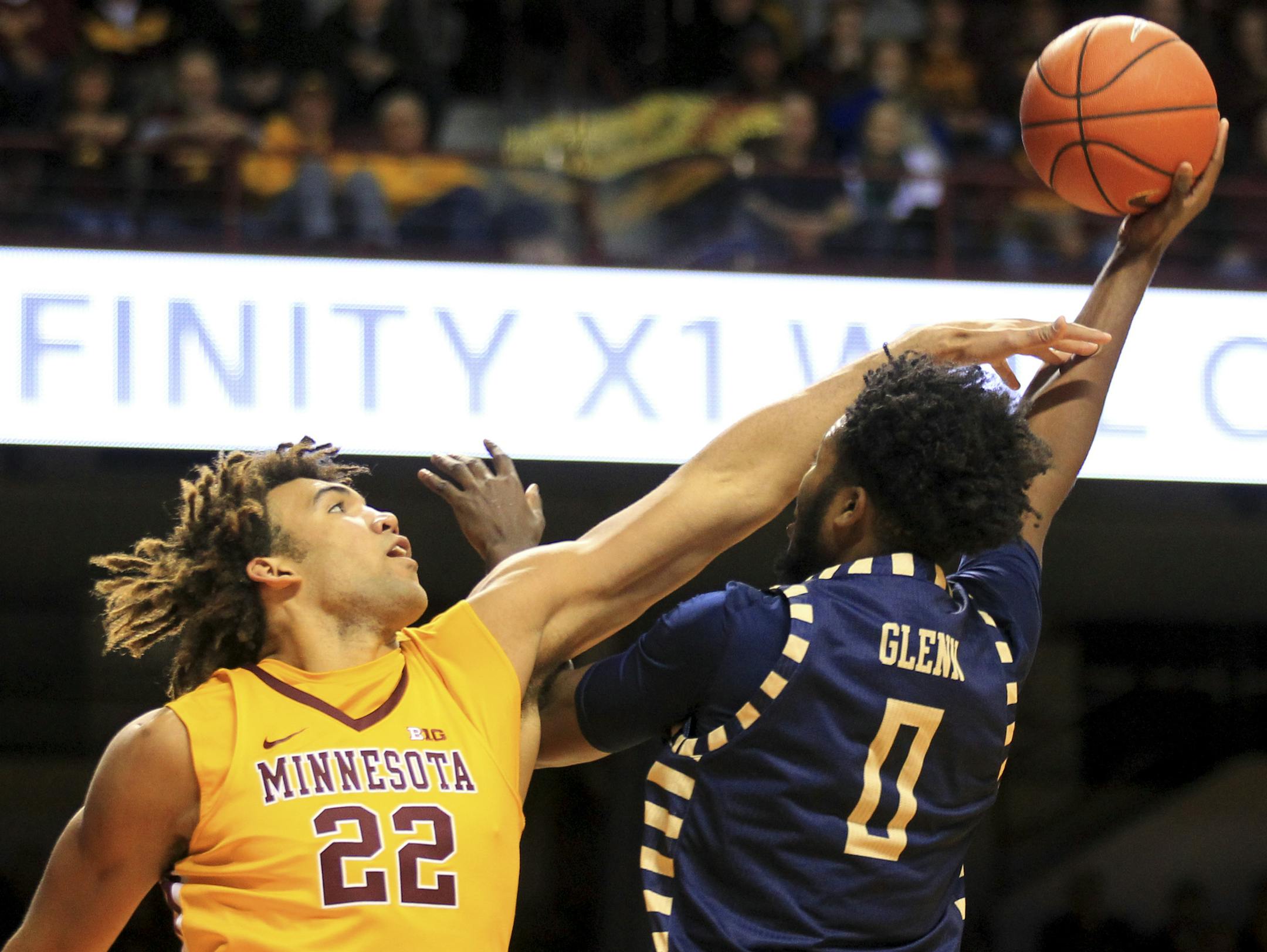 Minnesota center Reggie Lynch (22) fouls Georgia Southern forward Montae Glenn (0) in the first half of an NCAA college basketball game Friday, Dec. 9, 2016, in Minneapolis. (AP Photo/Andy Clayton-King)