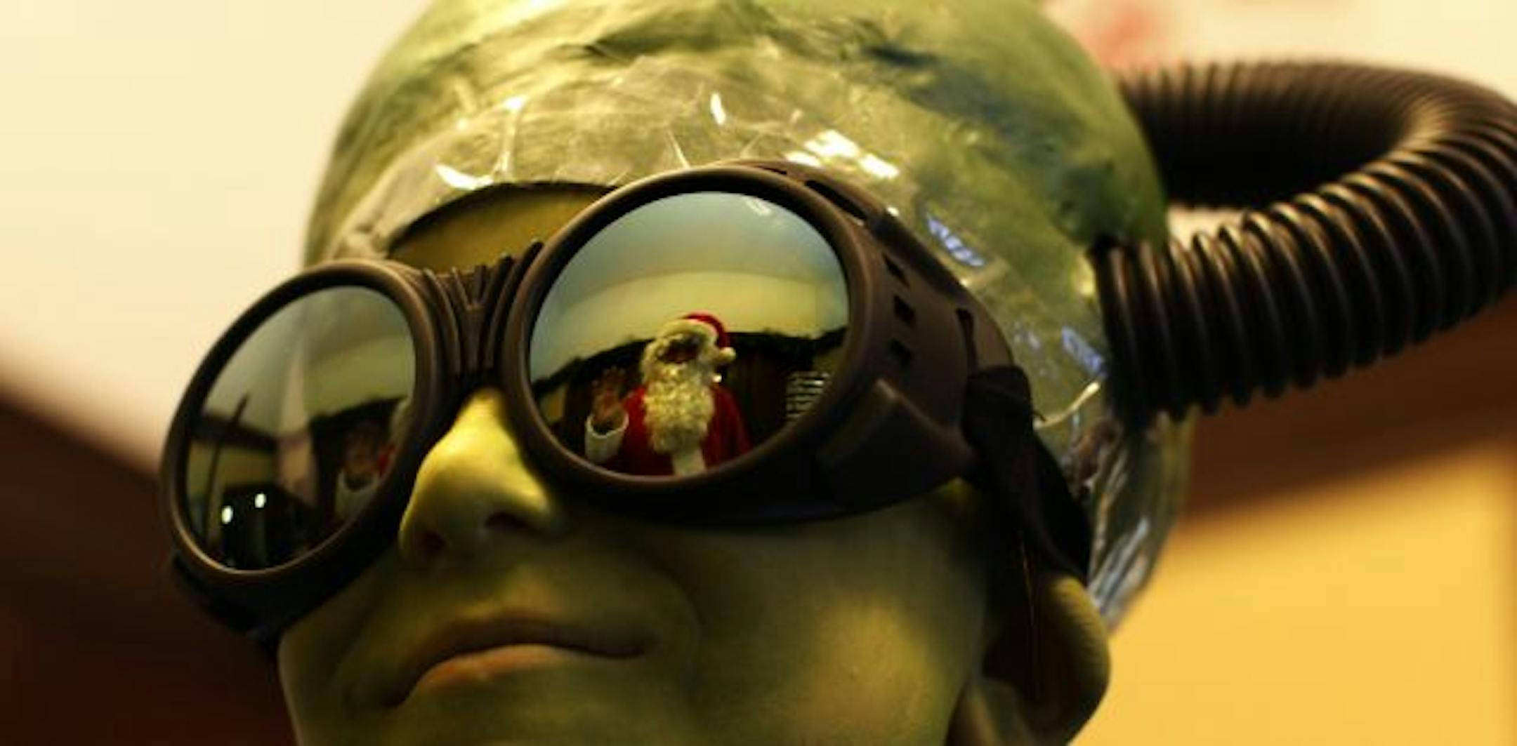 Santa was reflected in Ben Johnson glasses who were dressed as a Martian for the upcoming play �Santa Claus Conquers the Martians�. The Christmas play will be held at the Unitarian Universalist Church of Minnetonka.