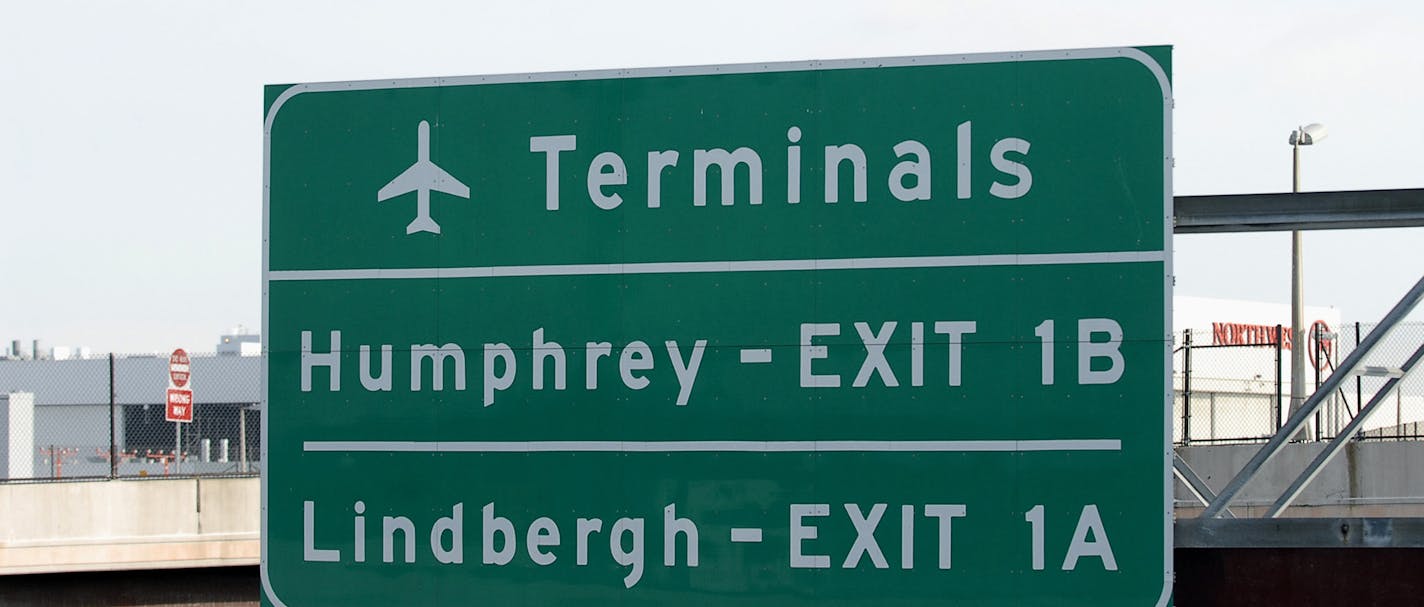 GLEN STUBBE &#x2022; gstubbe@startribune.com Monday, January 29, 2007 -- Bloomington, Minn. -- Northwest Airlines DC-9 jet lands at Minneapolis St. Paul Airport. A sign over I-494 points to exits for Humphrey and Lindbergh terminals. MSP NWA DC9 ORG XMIT: MIN2017090113141727