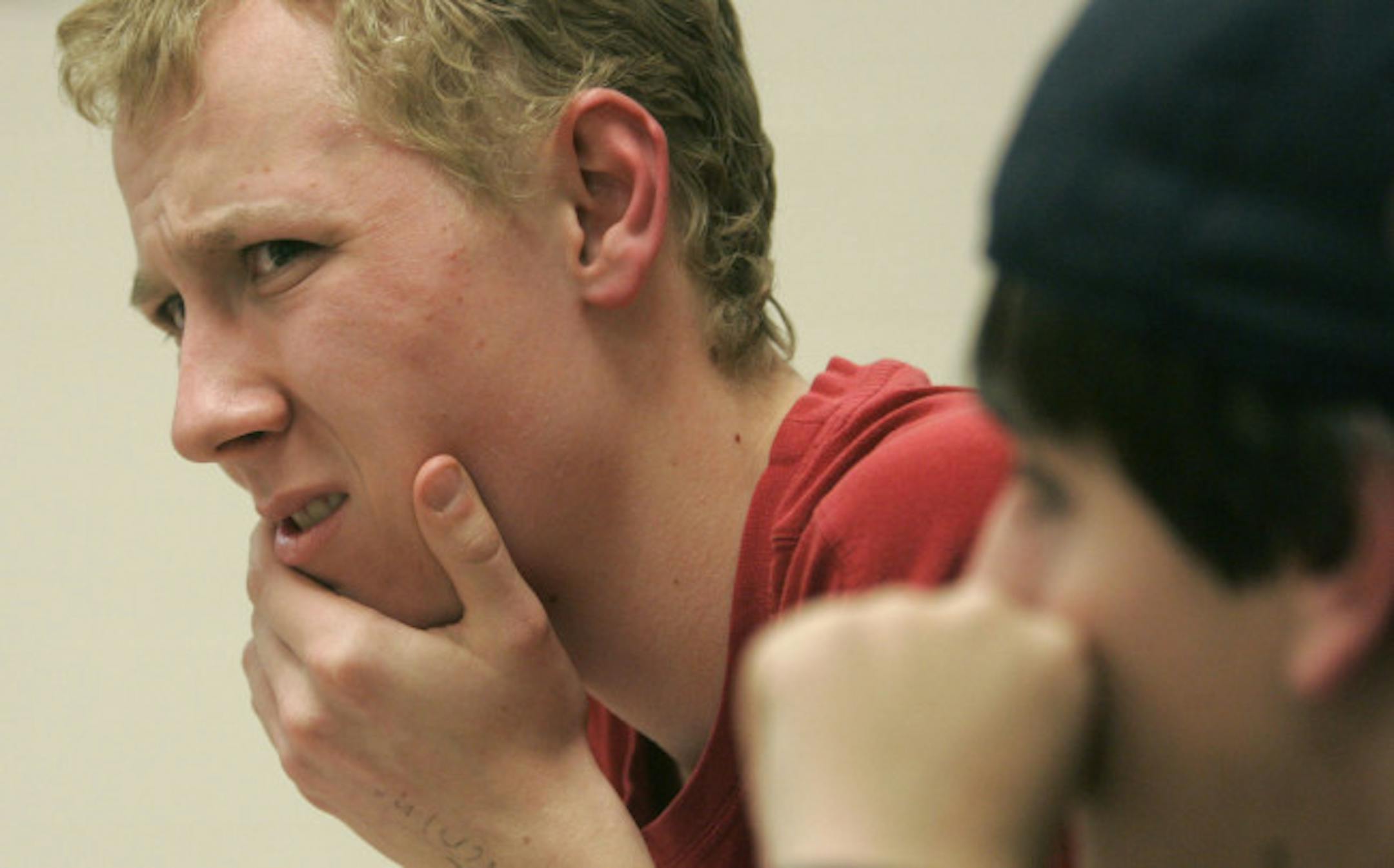 Jeremy Holm listened to a question posed by coach Matt Quinn.