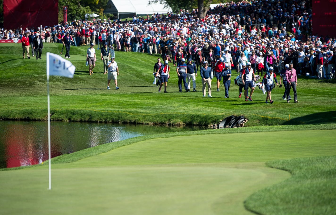 Team USA golfers with group one made their way toward the 17th green Thursday.