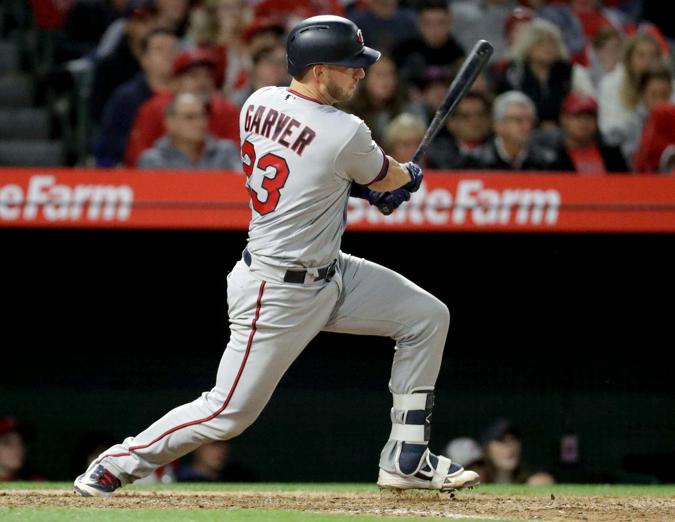 Mitch Garver watches his RBI-double against the Angels during the 12th inning Saturday.