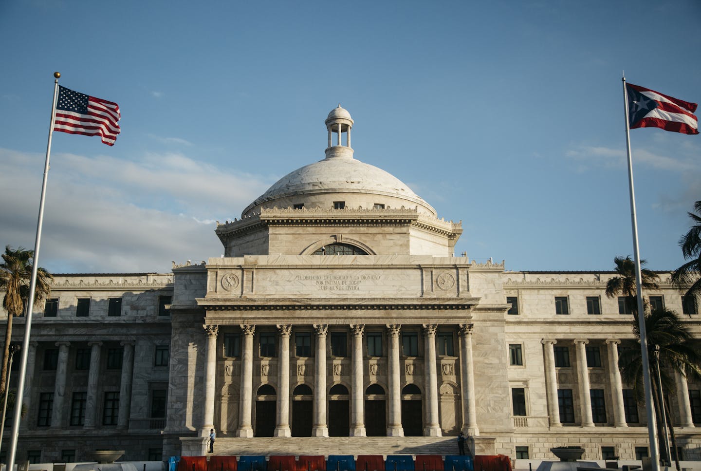 The American and Puerto Rican flags fly in front of the Capitol in San Juan, Puerto Rico, May 12, 2017. Given that this Caribbean commonwealth has entered a new and exotic version of bankruptcy and faces a staggering $123 billion in debt and pension obligations, it is difficult to imagine a worse time for its government to persuade Washington it is ready to become the 51st American state. (Erika P. Rodriguez/The New York Times)