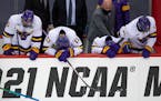 Minnesota State Mankato players hung their heads in disappointment after losing 5-4 in the men's hockey national semifinal to St. Cloud State.