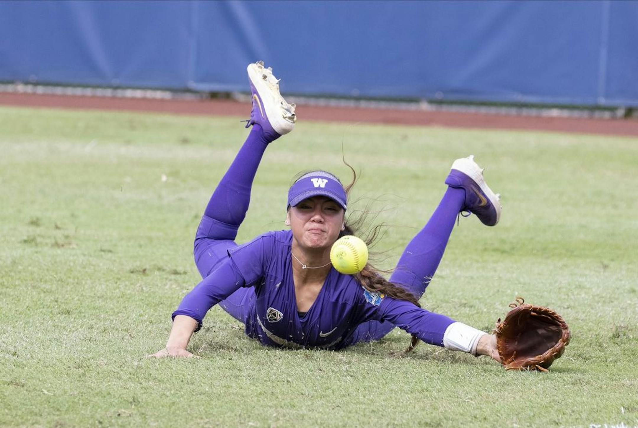 Washington's Madison Huskey misses a Minnesota fly ball to left field during the seventh inning of the Women's College World Series at ASA Hall of Fame Stadium in Oklahoma City on Saturday, June 1, 2019. Washington won 5-3. Photo by: Alonzo J. Adams