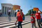 Demonstrators gathered outside the U.S. Supreme Court on Thursday as the justices finished the term with key decisions on gerrymandering and a case in
