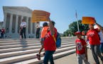 Demonstrators gathered outside the U.S. Supreme Court on Thursday as the justices finished the term with key decisions on gerrymandering and a case in