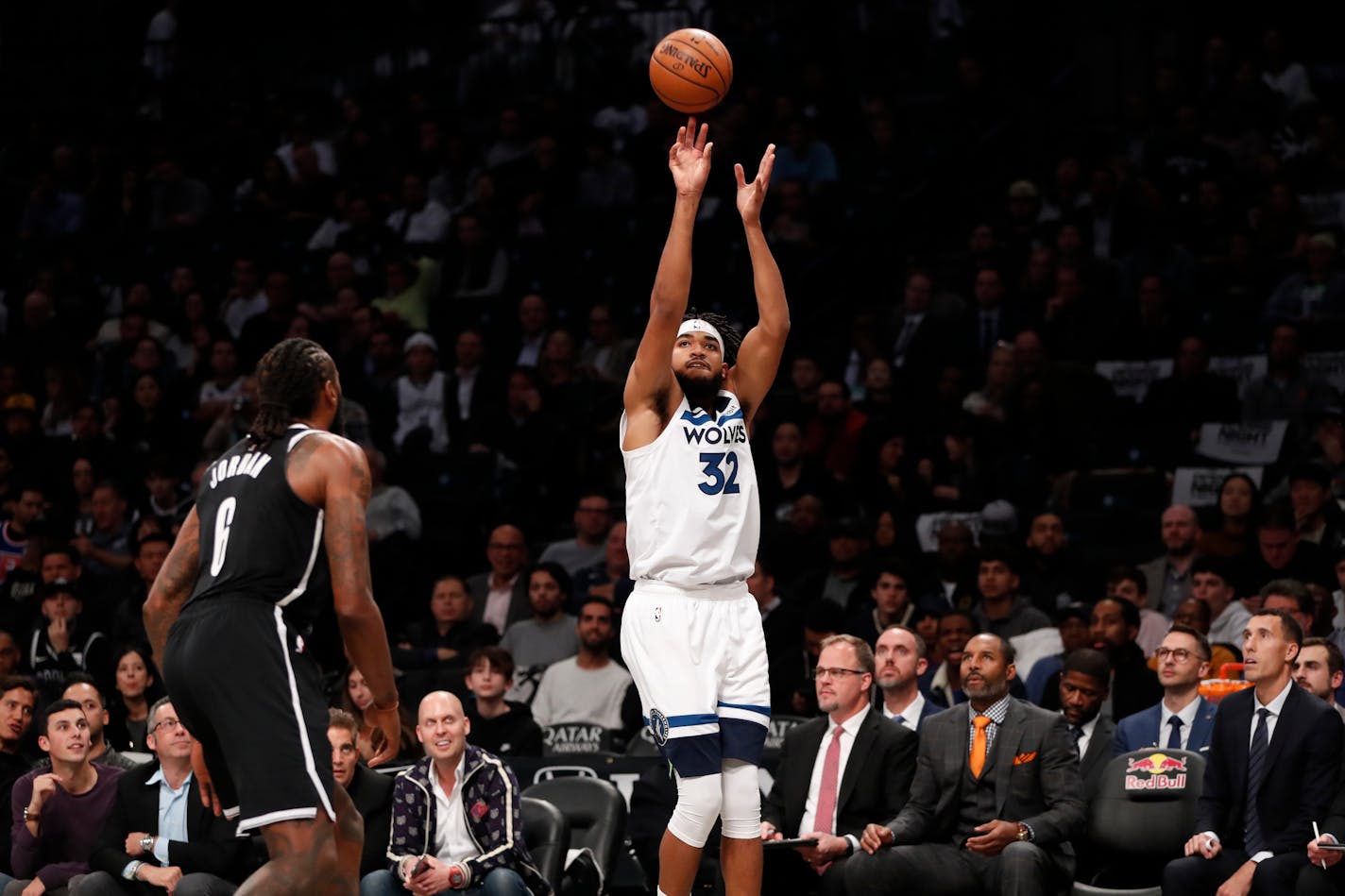 Brooklyn Nets center DeAndre Jordan (6) watches as Minnesota Timberwolves center Karl-Anthony Towns (32) releases a 3-point shot during the first half of an NBA basketball game Wednesday, Oct. 23, 2019, in New York. (AP Photo/Kathy Willens)