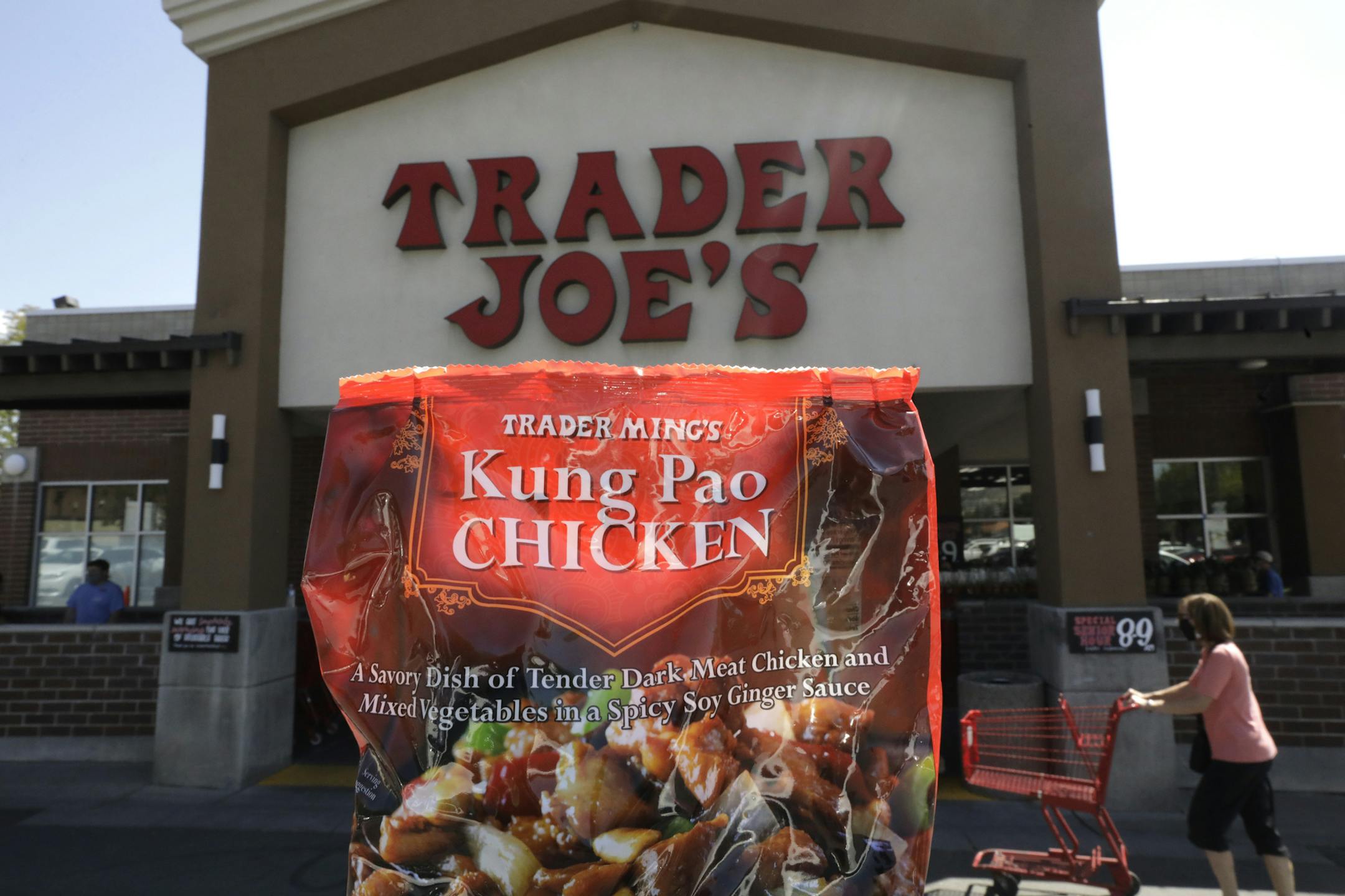 Trader Ming's Kung Pao Chicken is shown in from of Trader Joe's Friday, July 31, 2020, in Salt Lake City. The popular grocery chain Trader Joe's says it won't be changing ethnic-sounding labels on its line of Mexican, Chinese and other international foods, adding they are not racist. Earlier this month the company said it was looking at changing some labels. But now it says it has no problem with ethnic-food labels like Trader Jose's, Trader Ming's and Arabian Joe. (AP Photo/Rick Bowmer)
