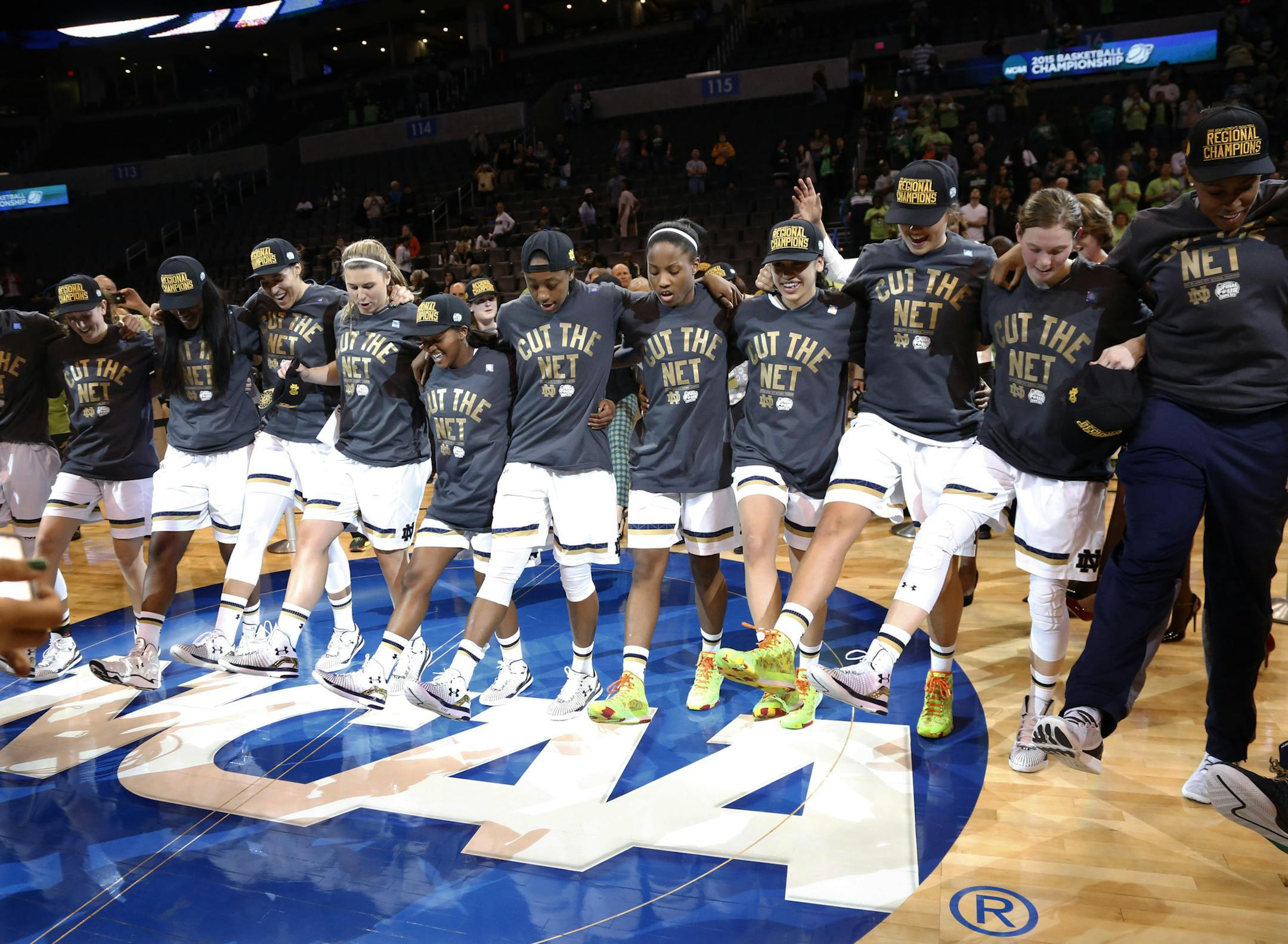 Notre Dame celebrates after defeating Baylor 77-68 in a regional final in the NCAA women's college basketball tournament, Sunday, March 29, 2015, in Oklahoma City. (AP Photo/Sue Ogrocki)