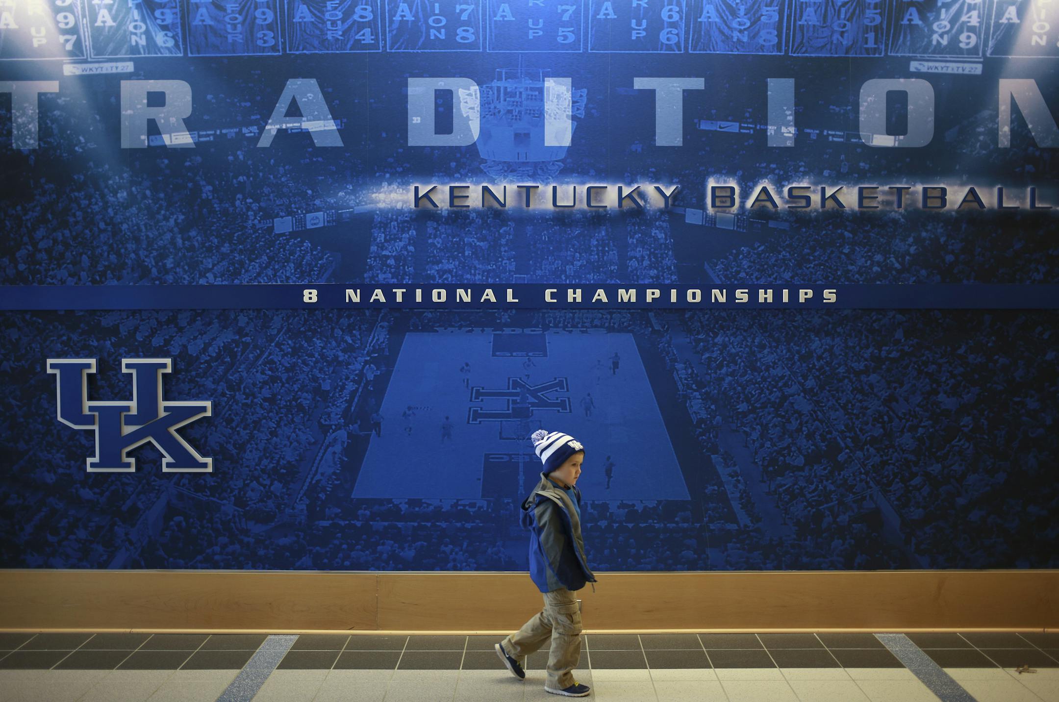 A young Wildcats fan walks inside the Joe Craft Center on the University of Kentucky campus in Lexington, Feb. 13, 2015. Basketball is a near-religion in Kentucky, but players born and bred there can find it hard even making the Wildcatsí ultra-talented ó and mostly recruited from out-of-state ó roster. (Luke Sharrett/The New York Times) ORG XMIT: MIN2015031320104562
