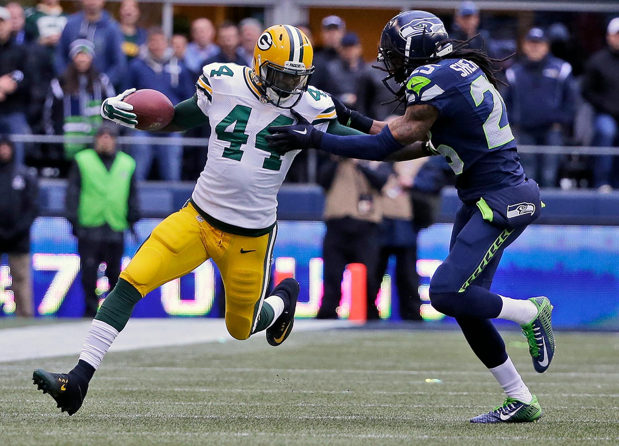 Green Bay Packers' James Starks tries to get away from Seattle Seahawks' Richard Sherman during the second half of the 2014 NFC title game.