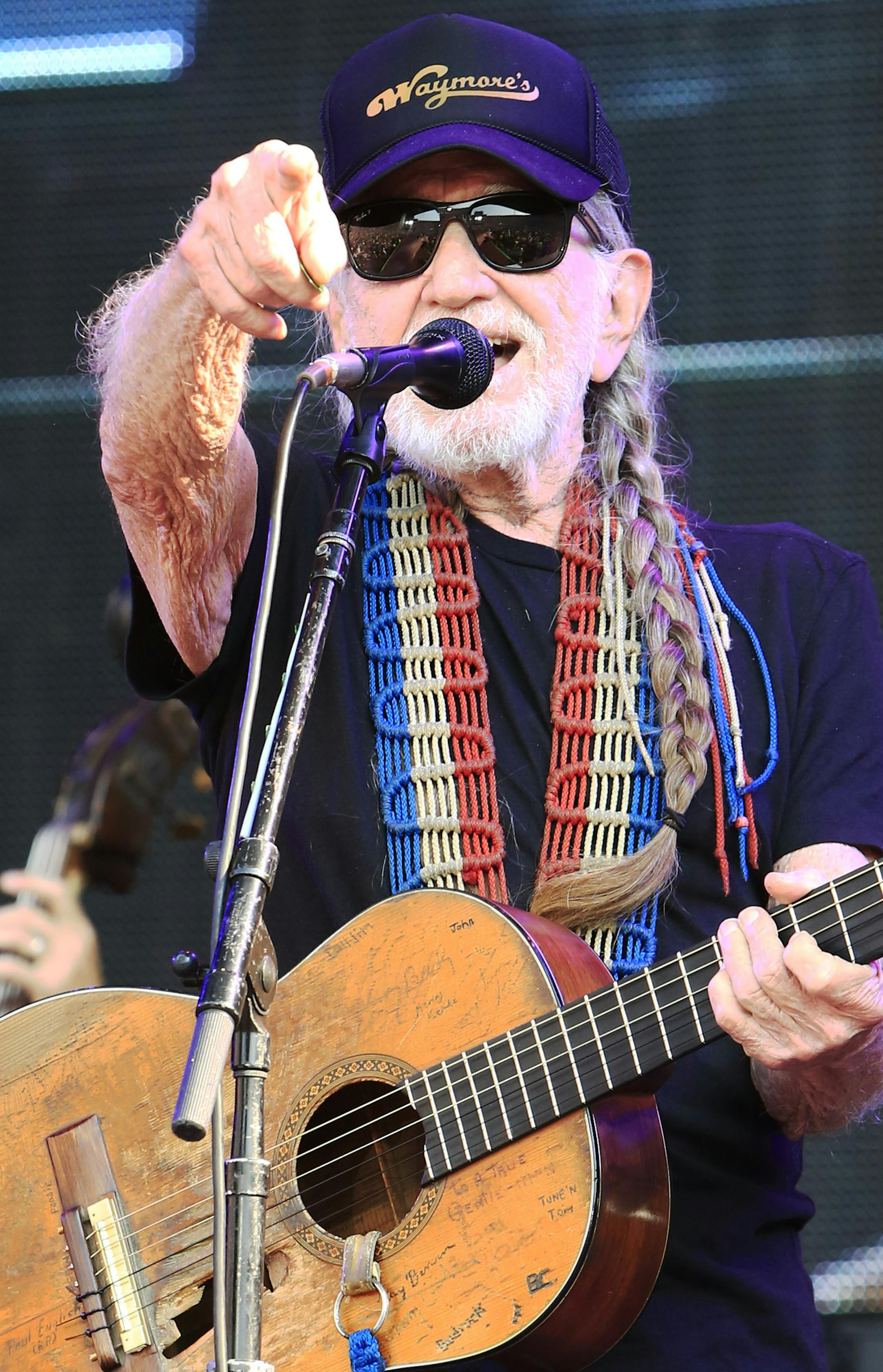 Willie Nelson performs at the Oklahoma Twister Relief Concert at the Gaylord Family-Oklahoma Memorial Stadium on Saturday, July 6, 2013 in Norman, Okla. (Photo by Alonzo Adams/Invision/AP)