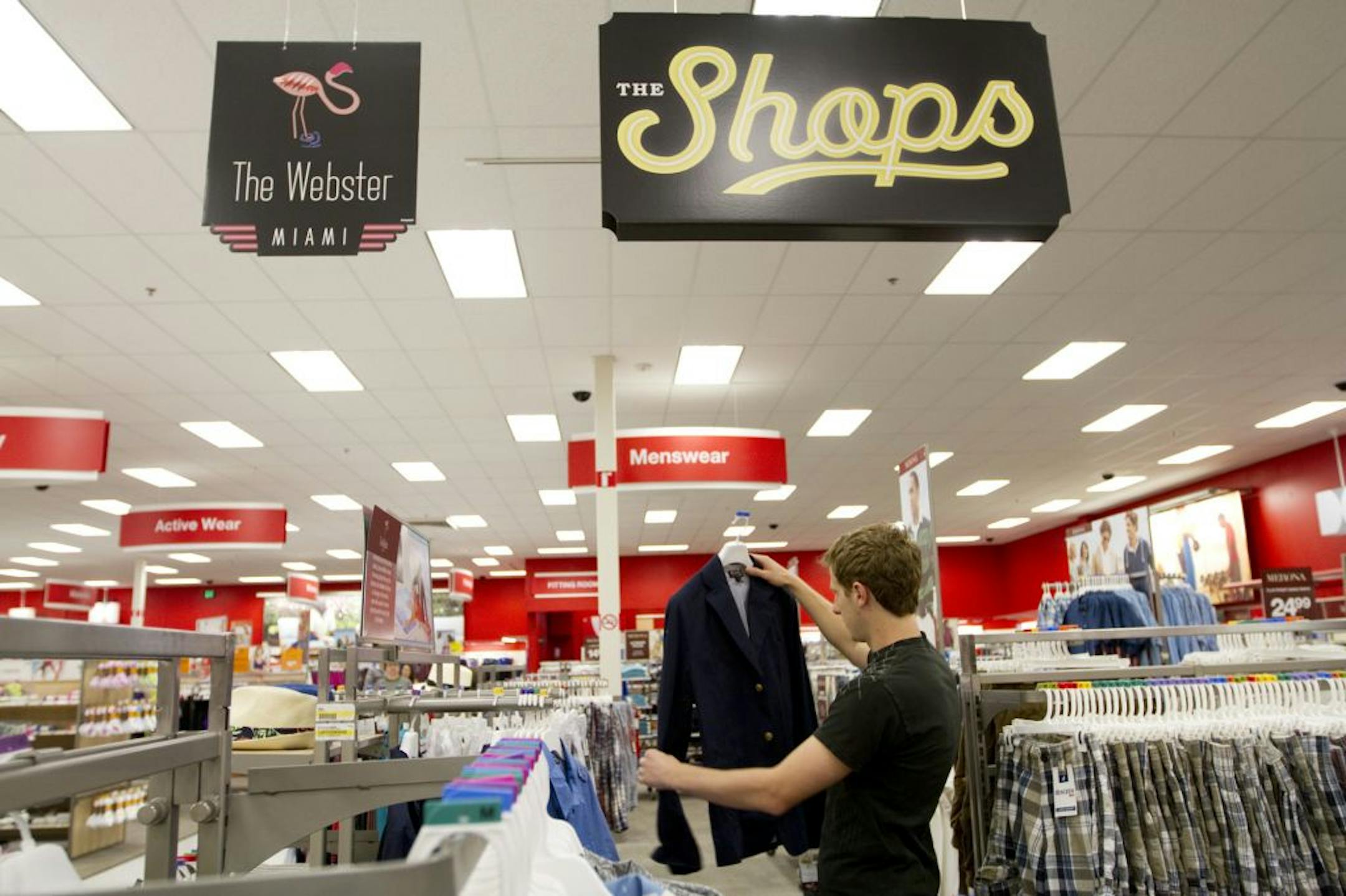 University of Minnesota student Jim Bieniek picks out a blue blazer in The Webster section of men's apparel at the Target in Northeast Minneapolis on Wednesday, May 9, 2012.