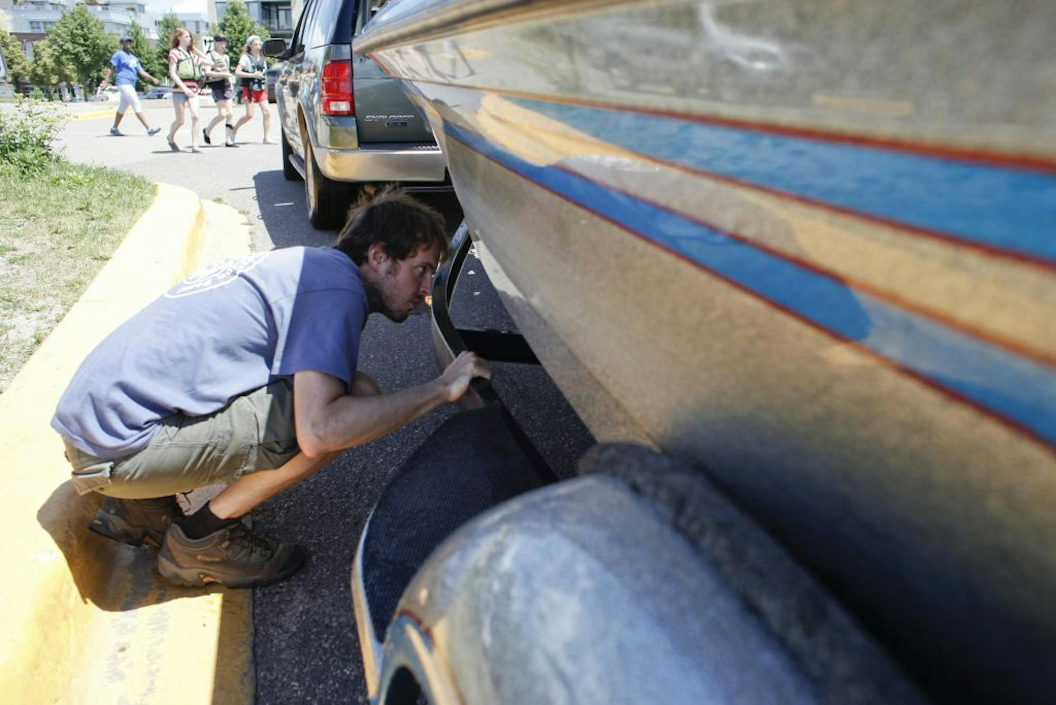 Tim Glenn, one of the boat inspectors at Lake Calhoun, checked for invasive species on Thursday.