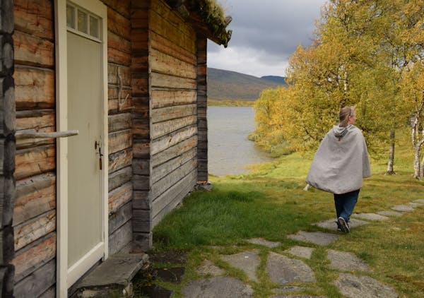 Anki Vinka runs the Sami Ecolodge alongside her husband, Mikael. While kerosene lamps are used at the secluded lodging, electricity and running water 