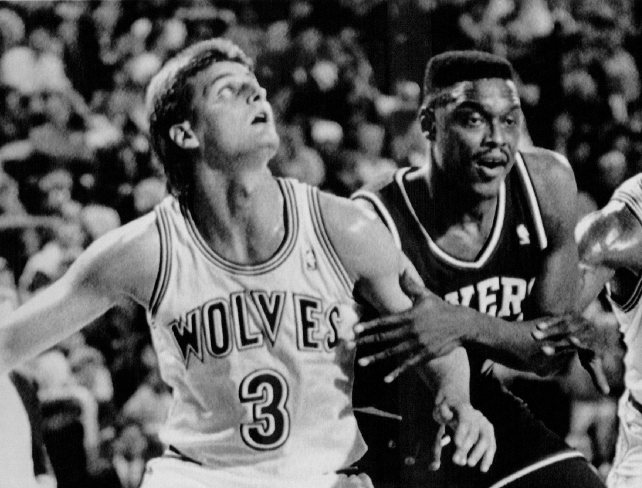 November 10, 1989 Can I Play too? -- Philadelphia 76er's Rick Mahorn, center tries to edge in between Minnesota Timberwolves Scott Roth (3) and Tony campbell (19) during NBA action Friday night.Mahorn, acquired by the Timberwolves in the expansion draft, was a holdout and just was recently traded to the 76er's JimMone, AP Laserphoto