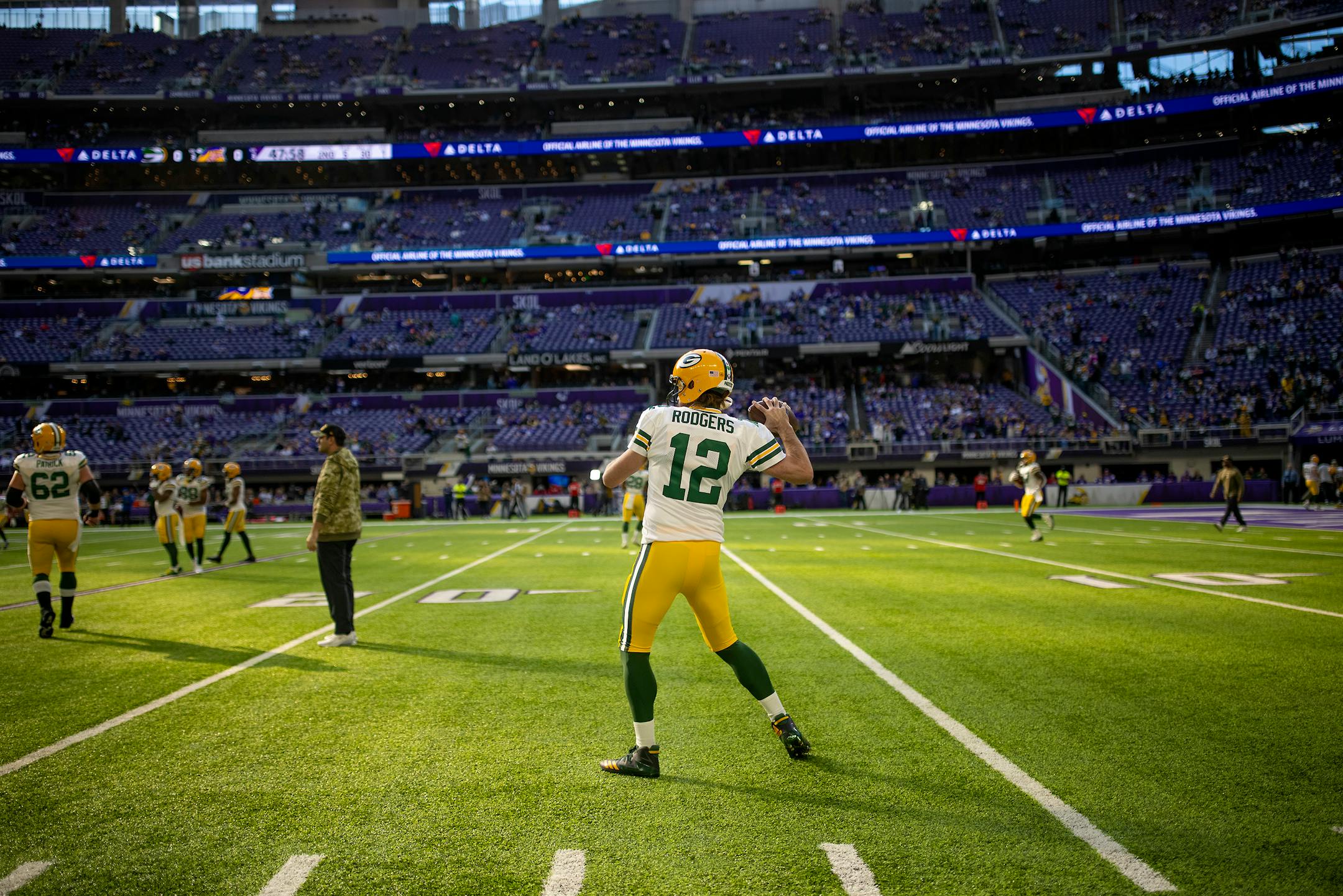 Packers quarterback Aaron Rodgers (12) warmed up on the field before the game, Sunday, Nov. 21, 2021 in Minneapolis.