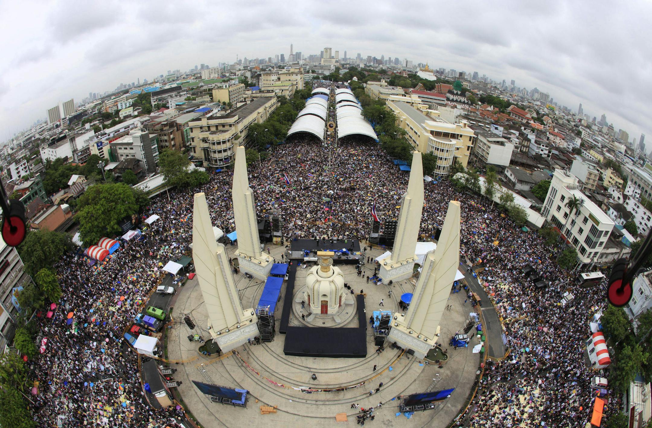 In this photo released by Siam 360 and taken from a drone, anti-government protesters stage a rally, calling for Thai Prime Minister Yingluck Shinawatra to step down, at Democracy Monument in Bangkok, Thailand, Sunday, Nov. 24, 2013. In the United States, the Federal Aviation Administration is developing new rules as the technology makes drones far more versatile, but for now operators can run afoul of regulations by using them for commercial purposes, including journalism. (AP Photo/Siam 360)
