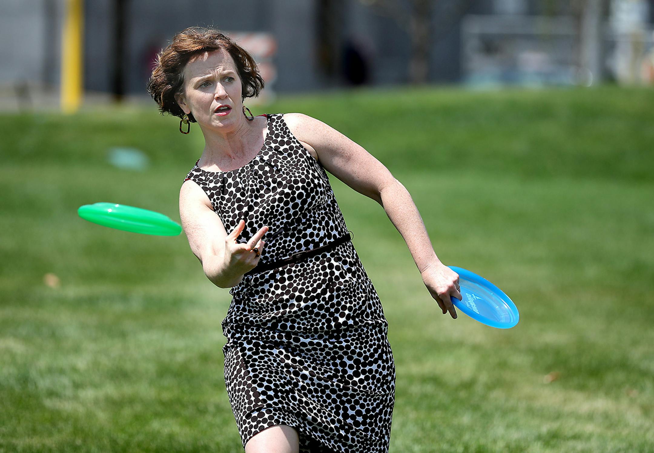 Minneapolis Mayor Betsy Hodges played frisbee on the grounds of the Downtown East Park after the grand opening ceremonies, Thursday, July 21, 2016 in Minneapolis, MN. ] (ELIZABETH FLORES/STAR TRIBUNE) ELIZABETH FLORES • eflores@startribune.com