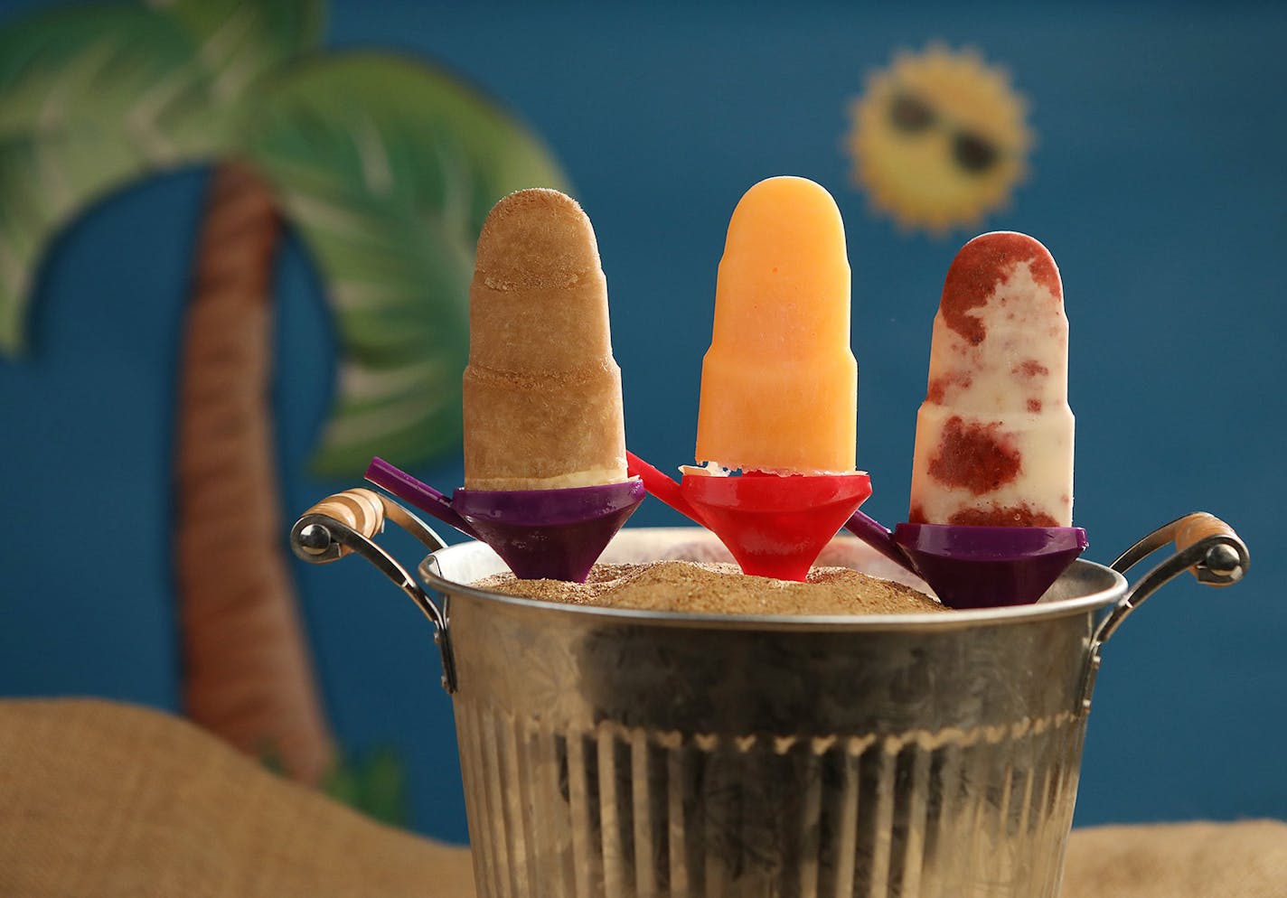 Homemade popsicles cool you down on a hot day. They are from left: Root Beer Float Popsicle, Cantaloupe Popsicle and Roasted Strawberries and Cream Popsicle.