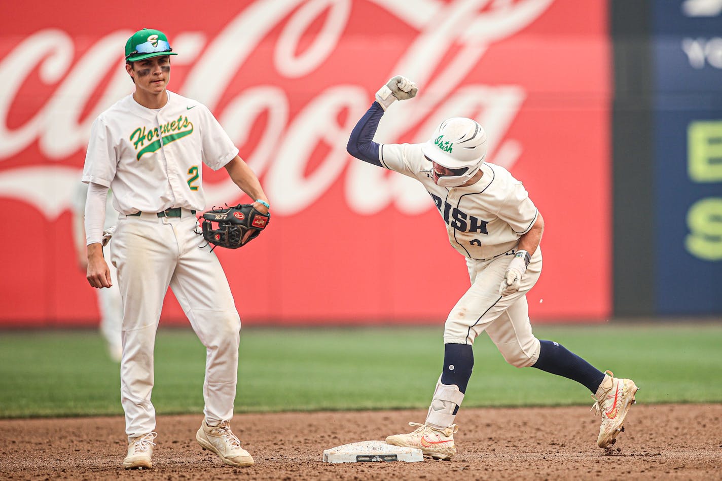 Rosemount's Cameron Richardson (right) celebrated his two-run double in the sixth inning as Edina infielder Lewis Meyer looked on. Top-seeded Rosemount beat Edina 12-2. Class 4A state baseball semifinals, Rosemount vs. Edina, 6-14-23. Photo by Mark Hvidsten, SportsEngine