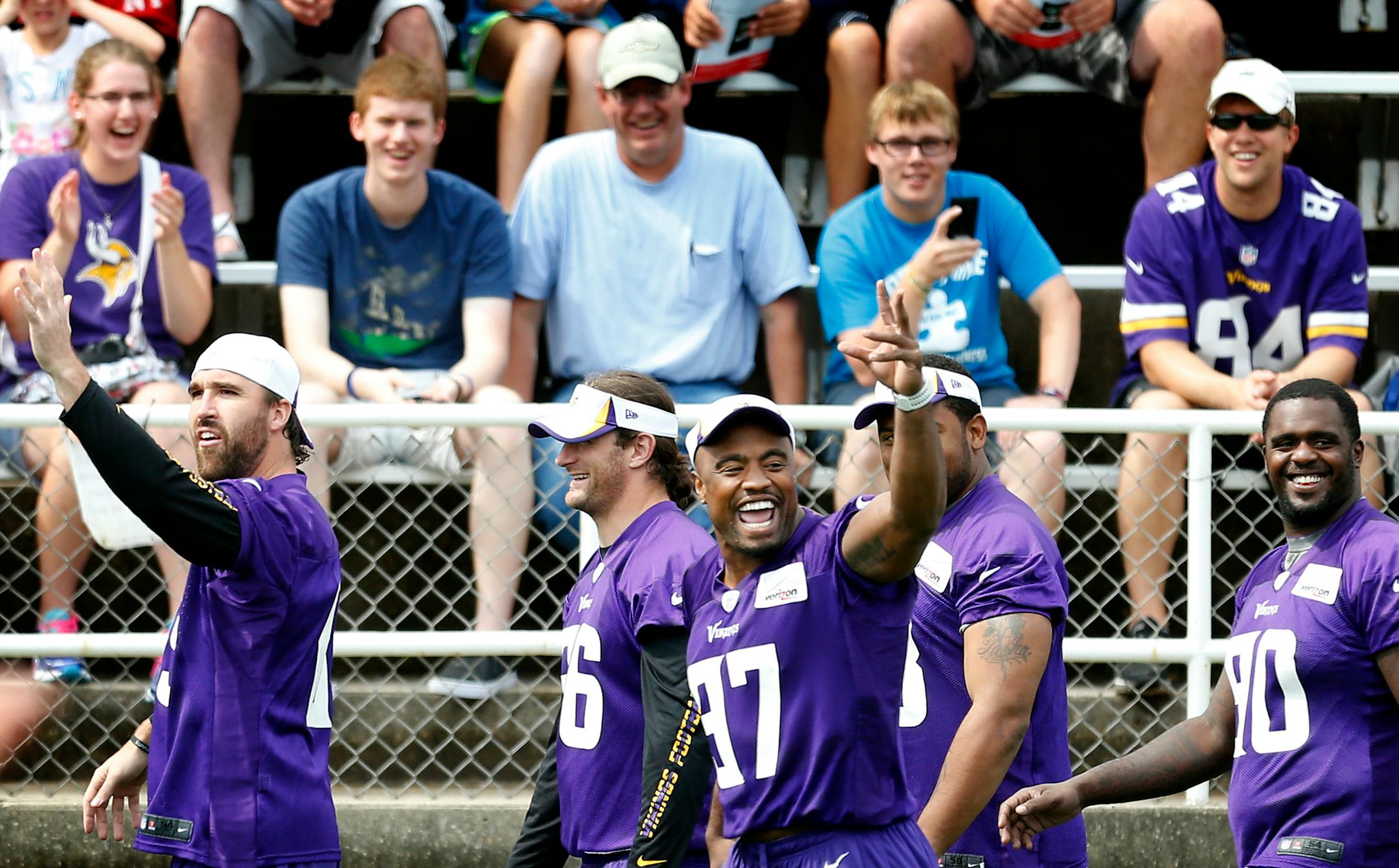Vikings defensive linemen, from left, Jared Allen, Brian Robison, Everson Griffen, Kevin Williams and Fred Evans laughed as they were applauded by teammates after being the last players to show up for Sunday's morning practice at Minnesota State Mankato.