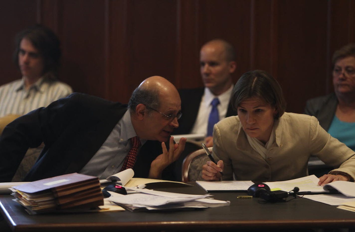 Alan Gilbert, left, state solicitor general, conferred with Minnesota Attorney General Lori Swanson at a hearing. Gilbert will be arguing Monday before the state Supreme Court in the lawsuit Swanon brought in 2010 against 3M Co.