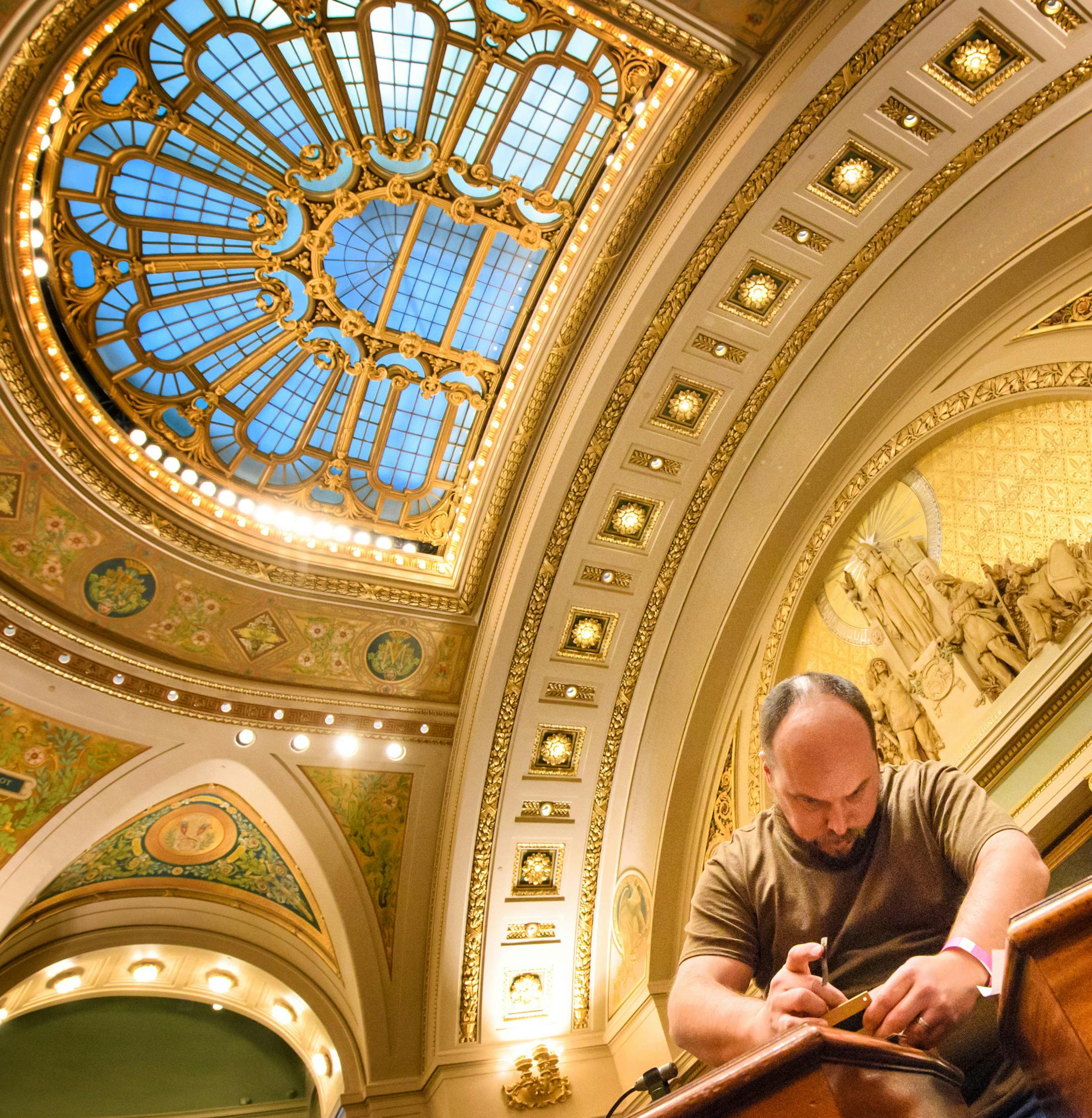Travis Waite of the House Chief Clerk's office moved nameplates of House members to their new seats in the House Chamber. ] GLEN STUBBE * gstubbe@startribune.com Wednesday, December 28, 2016 The Minnesota State Capitol gets ready for the 2017 legislative session January 3 after years of renovation and a $300 million makeover.