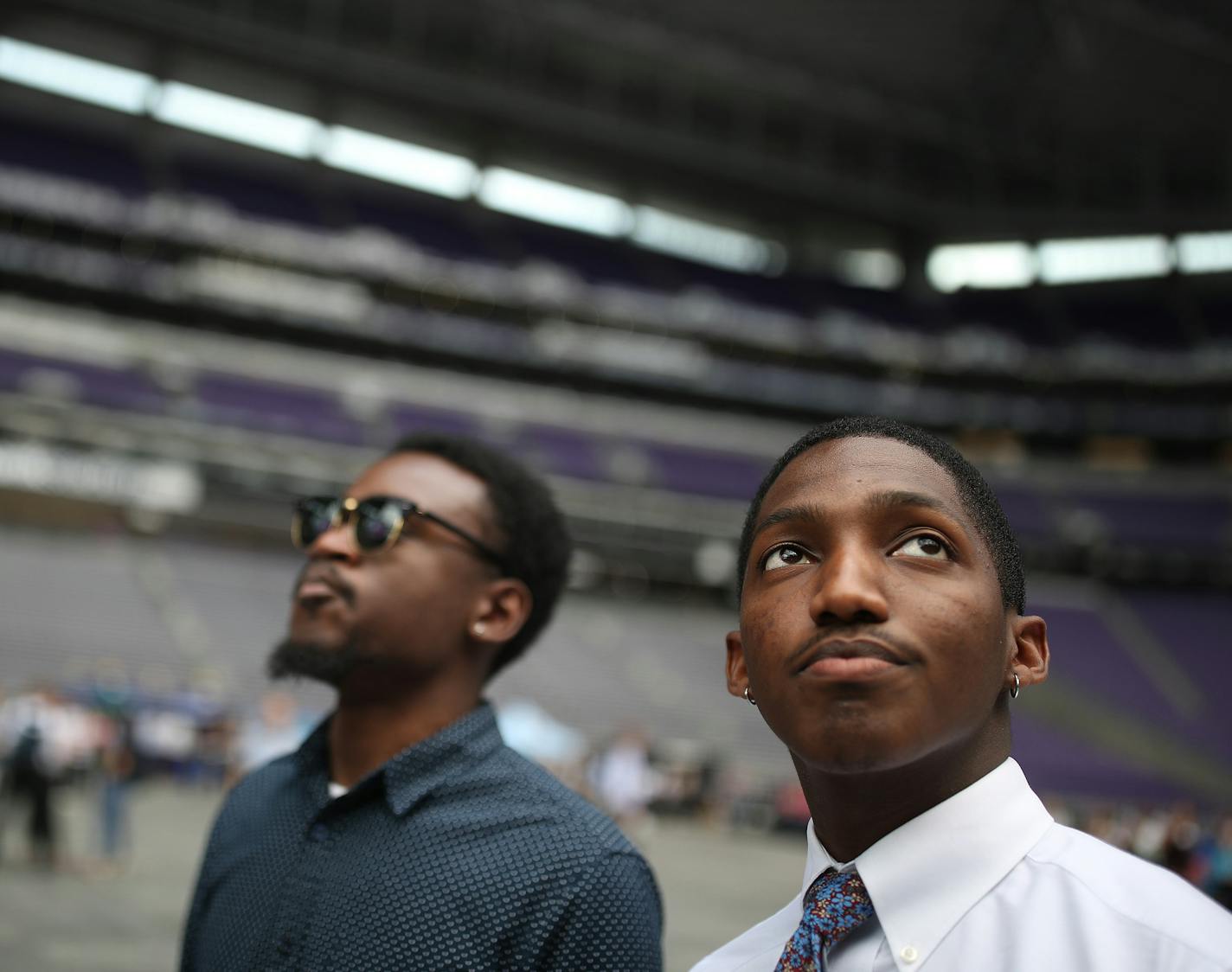 More than 1,200 interns from a few dozen large and mid-size companies in the Twin Cities spend the afternoon at U.S. Bank Stadium learning about the region, and being implored to come back and live here. Above, St. John's University students David Johns III, left, and Owyn Ferguson.