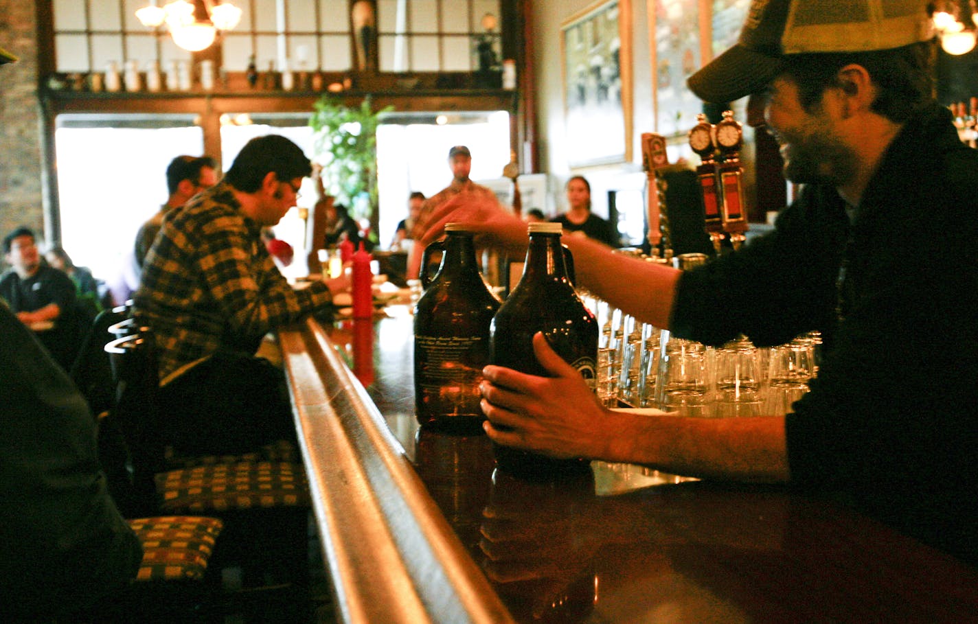 Minnesota law was changed in 2003 to allow breweries with annual production under 3,500 barrels to sell growlers for off-site consumption, like these growlers at Town Hall Brewery in Minneapolis' Seven Corners district.