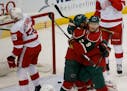 Mikko Koivu (9) and Matt Dumba celebrated a goal against Detroit in December. The two players tussled during the Wild's practice on Monday.