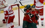 Mikko Koivu (9) and Matt Dumba celebrated a goal against Detroit in December. The two players tussled during the Wild's practice on Monday.