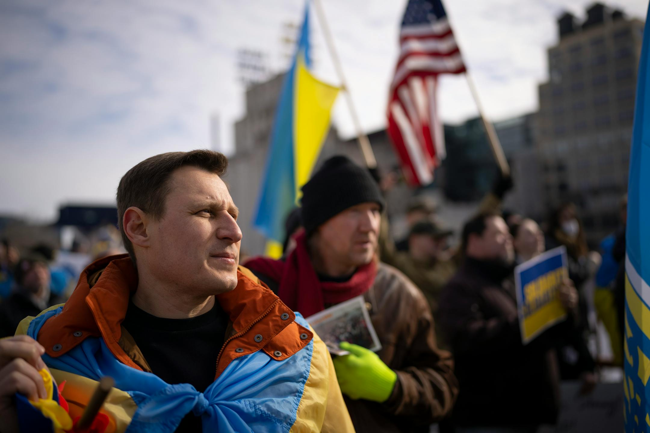 Sergey Movchan stood with Ukraine marchers paused midway across the Stone Arch Bridge to meet with a delegation of Belarusians in a united show of support for Ukraine Sunday afternoon, February 27, 2022 in Minneapolis, Minn. Hundreds of supporters of the people of Ukraine met a few dozen supporters of the Belarusian people midway across the Stone Arch Bridge in Minneapolis before continuing on a march together across the Hennepin Ave. bridge to Northeast Minneapolis where the march first began. ] JEFF WHEELER • Jeff.Wheeler@startribune.com
