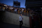 Gophers athletic director Mark Coyle walked onto the field before the start of Saturday's game against Maryland. ] Aaron Lavinsky • aaron.lavinsky@s