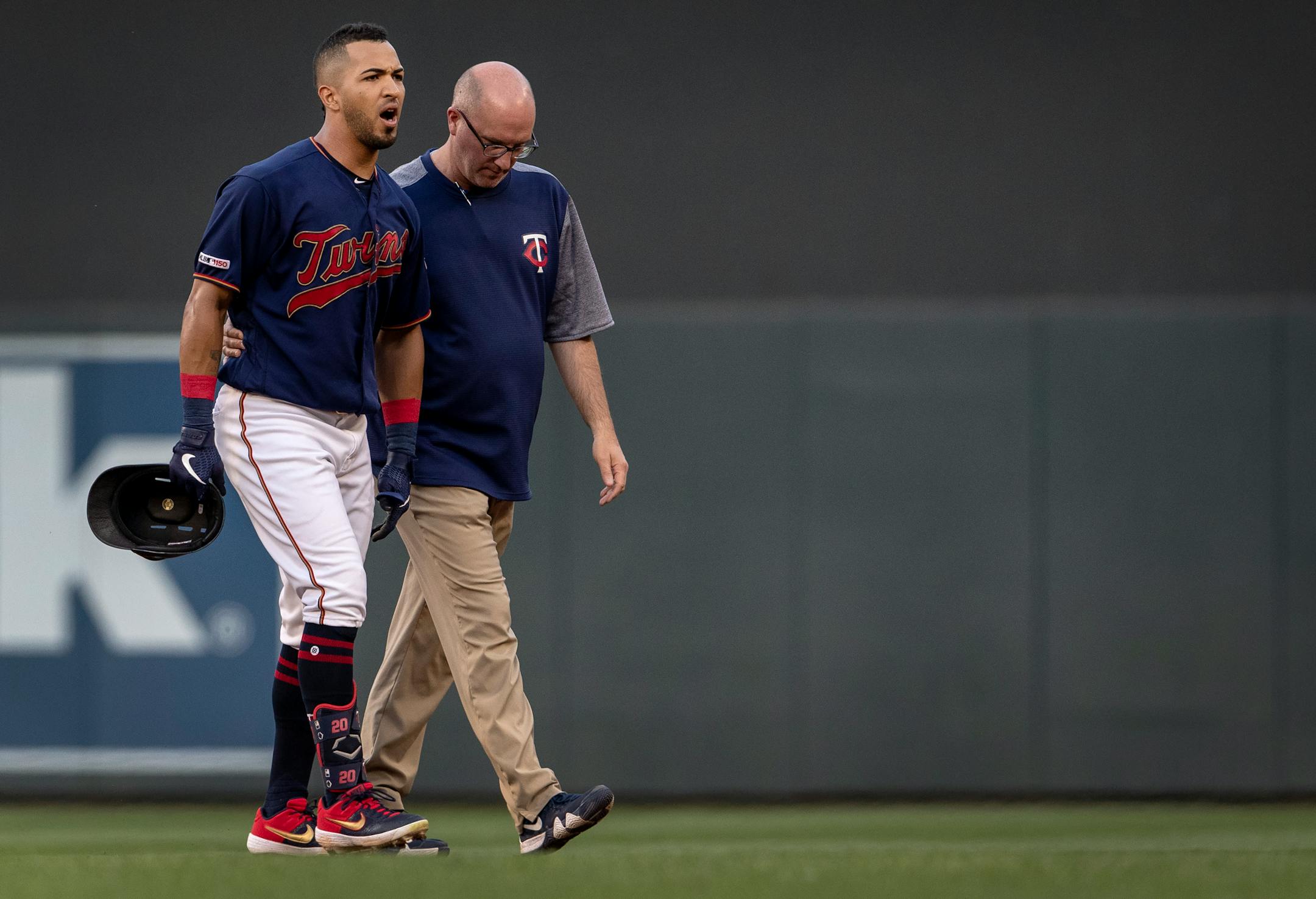 Eddie Rosario walked off the field in the third inning after injuring his ankle trying for a double.