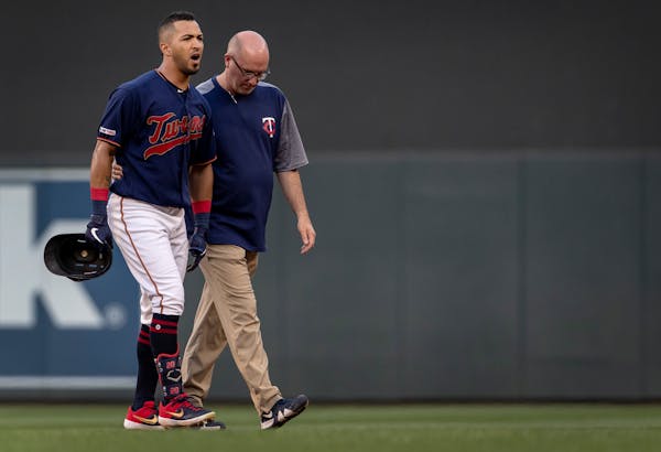 Eddie Rosario walked off the field in the third inning after injuring his ankle trying for a double.