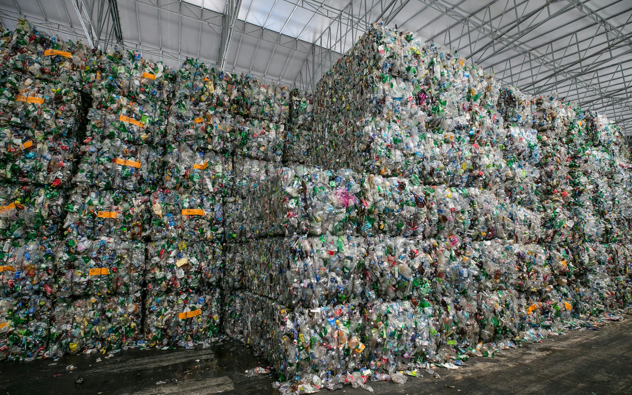 Bales of compressed plastic waste stand at a Junyoung Industrial facility in Gimpo, South Korea, in April 2018. MUST CREDIT: Bloomberg photo by Jean Chung
