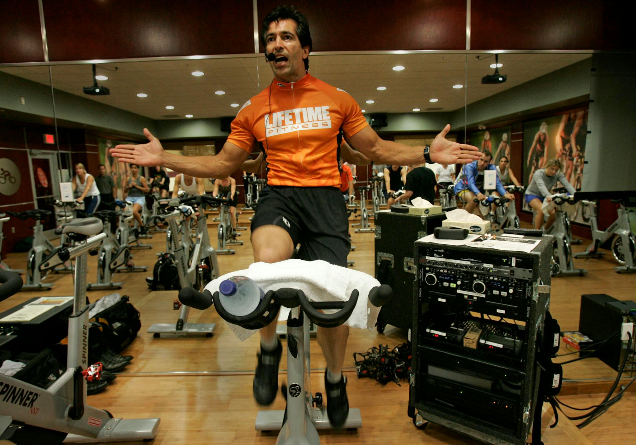 Lifetime Fitness founder and CEO Bahram Akradi, who extolls a life of fitness, leads a weekly spinning class he teaches at the Lifetime Fitness Chanhassen mega-gym.
